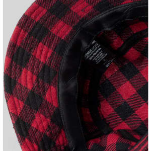 A red and black checked bucket hat with a soft inner lining and a care label inside.