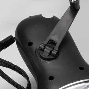 A black Dynamo Solar Torch featuring a foldable handle and a lanyard attachment.