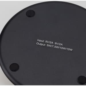 A Bamboo 15W wireless fast charger in a sleek black design, featuring a smooth surface and rubberised base for stability.