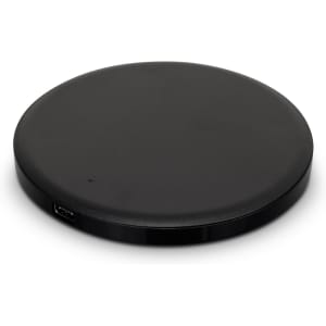 A round black wireless charger with a sleek design, featuring a USB port.