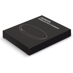A black packaging box containing the Energon Wireless Fast Charger, featuring a simple design and a logo.