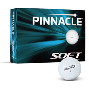 A box of Pinnacle Soft Golf Balls with a white golf ball displayed in front, featuring a logo on the packaging.