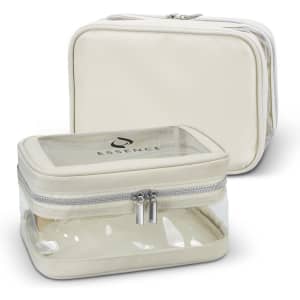 A cream-coloured cosmetic bag with a transparent front and silver zippers. It features a logo on the surface.