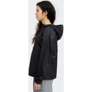 A black women's windbreaker jacket featuring a hood and a logo. The model is posed in profile against a light background.