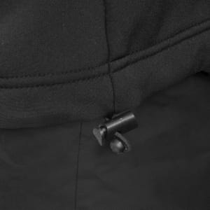 A close-up of a black vest featuring drawstring adjustments and a stitched seam detail. It includes a logo.