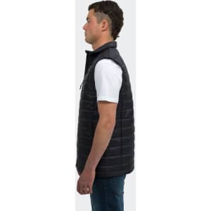 A unisex puffer vest in black, featuring a zip front and a high collar, displayed on a person from the side.