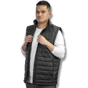 A black puffer vest is worn by a model, featuring a high collar and zip closure, set against a white background.