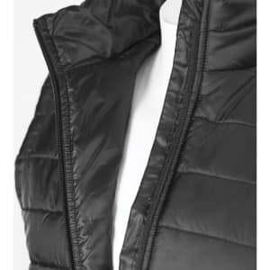 A black women's puffer vest with a zippered opening and quilted texture, displayed on a mannequin.