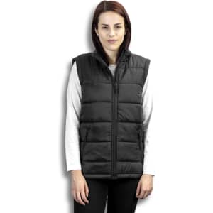 A woman wearing a black puffer vest with a high collar and zip front, styled over a long-sleeve white top.