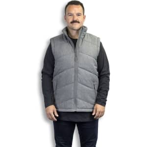 A grey puffer vest with a zip front and high collar, worn by a man with a moustache. 