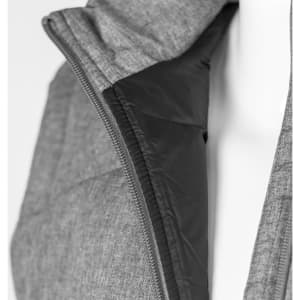 A grey women's puffer vest featuring a black interior and a zippered closure. The vest has a subtle logo.