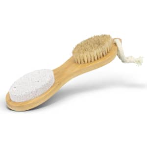 A NATURA pedicure tool featuring a bamboo handle, a brush, and a pumice stone, with natural bristles and a white stone.
