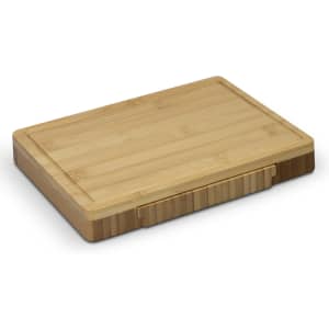 A rectangular bamboo cheese board with a smooth surface and a slightly raised edge. It includes ribbed sections on the side.