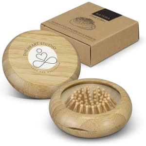 A bamboo brush and mirror set in a round case, accompanied by a brown outer box with a logo.