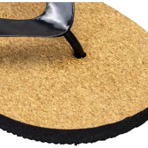 A black thong sandal with a cork footbed and a rubber sole, featuring a logo on the strap.