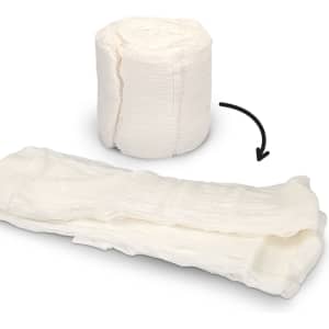 A white compressed towel rolled up and expanded, showcasing its texture and soft, absorbent design.