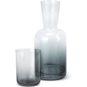 A drink bottle and tumbler set in a sleek grey gradient glass design with a modern silhouette.
