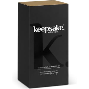 A black and gold box containing the Keepsake Dusk Carafe and Tumbler Set, featuring a branding logo.