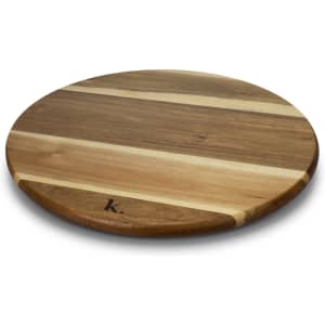 A wooden Lazy Susan featuring a circular design with a mix of light and dark wood stripes, branded with a logo.