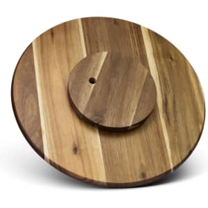 A wooden lazy Susan featuring a round design with varying shades of brown and a central circular rotating section.