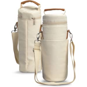 A cream-coloured wine cooler bag with a removable shoulder strap and a wooden handle, featuring a zip closure and a side pocket.