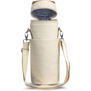 A cream cooler bag with a removable lid, featuring a shoulder strap and an inner lining for insulation.