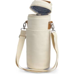 A cream wine cooler bag with a detachable strap and a soft inner lining, featuring a lid and leather accents.