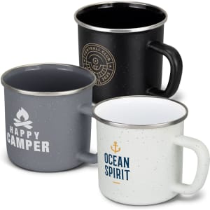 A set of three matte enamel mugs in black, grey, and white, each with distinct logos and designs.