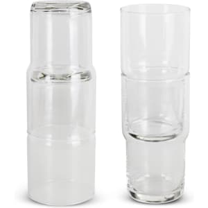 A stackable glass tumbler set in clear glass, featuring four tumblers and a larger glass.