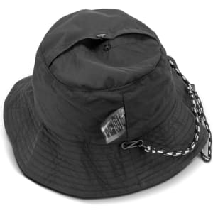 A black packable bucket hat with a chin strap and a logo tag on the side.