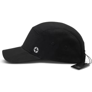 A black Swiss Peak 5 Panel Cap with a branded logo and a tag. Features a curved brim and ventilation holes.