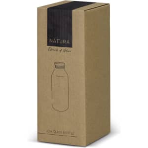A drink bottle in a kraft paper box, featuring a simple design and a logo. The bottle appears clear and glass.