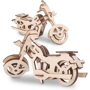 A wooden motorcycle model kit featuring two assembled bikes, showcasing intricate cut-out designs and a natural finish.