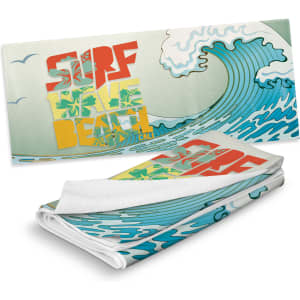 A full-colour sand-free towel featuring a vibrant surf and beach design with blue waves and bright lettering.