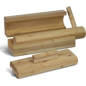 A bamboo sushi maker set featuring various shapes and sizes in a natural wood finish. Includes a rolling tool.