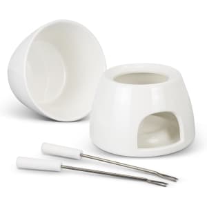 A white mini fondue set featuring a ceramic bowl, base, and two fork utensils.