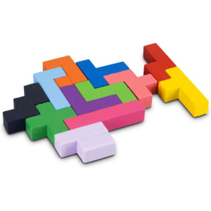 A colourful wooden pentomino puzzle featuring various geometric shapes in red, blue, green, yellow, pink, purple, and black.