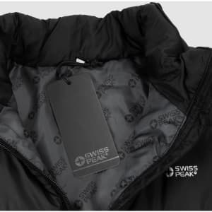 A black puffer vest with a high collar, featuring a tag and a subtle logo inside.