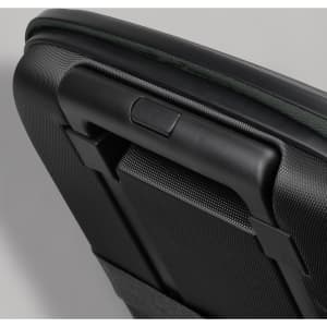 A medium-sized wheeled suitcase with a textured black surface and a green trim, featuring a sturdy handle.