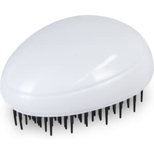 A white hair detangler with black bristles, shaped like a smooth, curved pebble. It has a logo on the surface.