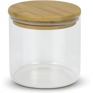 A large round storage canister made of clear glass with a bamboo lid.
