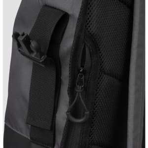 A grey and black Fjord Backpack features zippers and adjustable straps, with various textured materials.