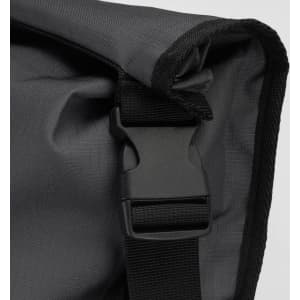 A black backpack with a textured fabric and a sturdy buckle closure. It features a simple design and a logo.