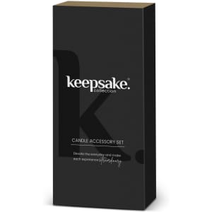 A black box containing a candle accessory set, featuring a minimalistic design and a logo.