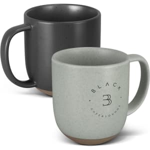 A ceramic mug set featuring a speckled black mug and a speckled green mug, both with contrasting bases and logos.
