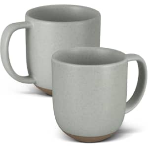 A set of two grey ceramic mugs with a textured finish and a brown base. Each mug has a sturdy handle and a minimalist design.