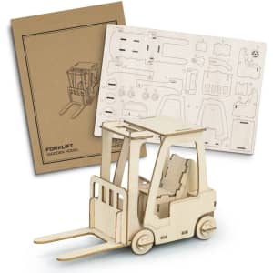 A wooden model of a forklift with an assembly kit, featuring a tan colour and intricate cut-out pieces.