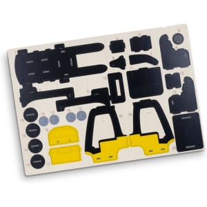 A wooden model kit featuring black and yellow forklift pieces, with various shapes and components on a light background.