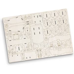 A wooden model kit featuring various pieces for constructing a mining truck, in light beige tones.