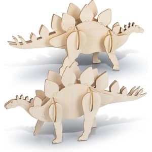 A wooden model of a Stegosaurus in a natural finish, featuring distinctive spiky plates along its back.